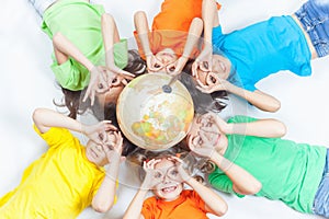 Group of international funny kids with globe earth