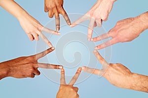 Group of international people showing peace sign