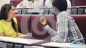 Group of international students talking at lecture