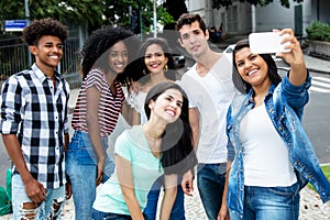 Group of international young adult people taking selfie