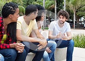 Group of international young adults in discussion about politics