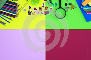 Group of items for back to school on colorful background,  pencils, notebooks, scissors, magnifying elements - education concept,