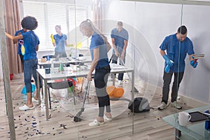 Group Of Janitors Cleaning Office photo