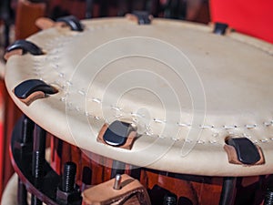 Group of japanese musicians are playing on Taiko drums.