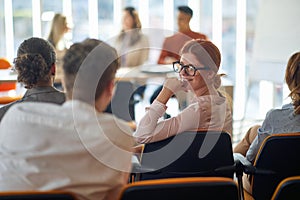 Group of job candidates waiting for an interview at conference hall. People, job, company, business concept