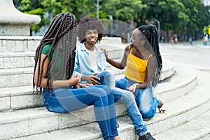 Group of jobless african american male and female young adults hanging out