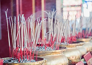Group of joss stick in the golden pot at Chinese temple