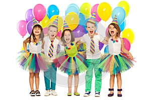 Group of joyful little kids having fun at birthday