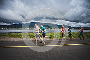 Group of 10K Runners in front of a beautiful Mountain Landscape