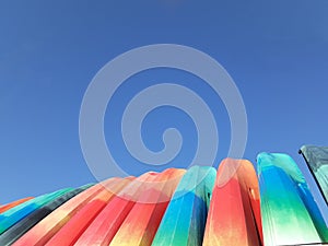 Group of kayaks tips against clear blue summer day  sky