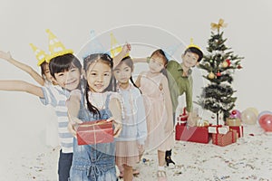 Group of kids celebrate Christmas and happy new year party