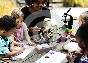 Group of kids classmates learning biology drawing class