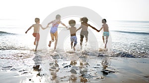 Group of kids enjoying their time at the beach