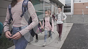 Group of kids happy to finish school day