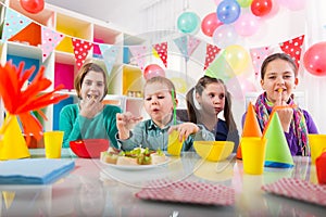 Group of kids having fun at birthday party