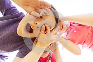 Group of kids having fun and making faces outdoors