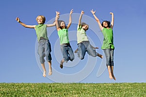 Group of kids jumping at summer camp