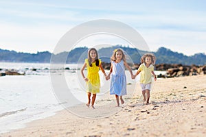 Group of kids playing on tropical beach