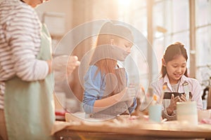 Group of Kids in Pottery Workshop