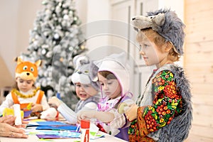 Group of kids preparing to christmas holiday. Children weared animal costumes