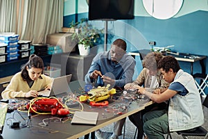 Group of Kids Programming in Robotics Class