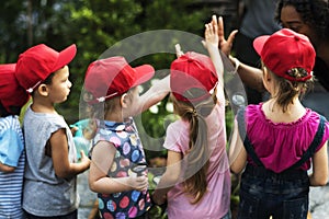 Group of kids school field trips learning outdoors active smiling fun photo