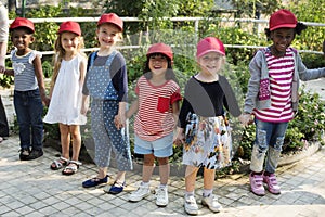 Group of kids school field trips learning outdoors botanic park photo