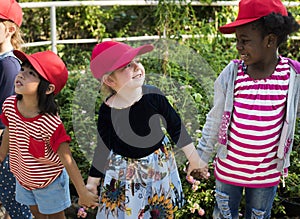 Group of kids school field trips learning outdoors botanic park