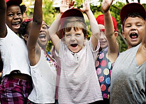 Group of kids school friends hand raised happiness smiling learn