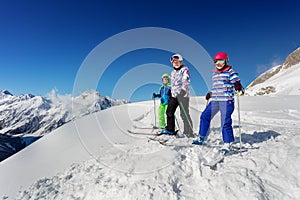 Group of kids ski sport portrait on mountain top