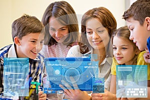 Group of kids with teacher and tablet pc at school