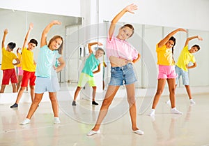 Group of kids training dance moves