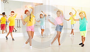 Group of kids training modern dance moves