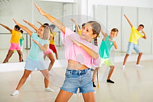 Group of kids training modern dance moves