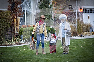 Group of Kids Trick or Treating on Halloween in a decorated neighborhood