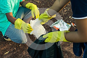 Group of kids volunteer help garbage collection charity.