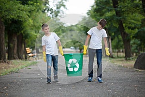 Group of kids volunteer help garbage collection charity environment, selective soft focus. Team work.