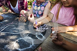 Group of kindergarten kids friends drawing art class outdoors