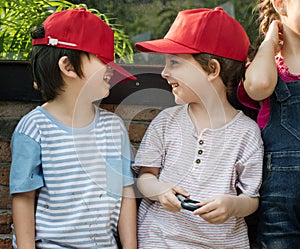 Group of kindergarten kids learning gardening outdoors field tri