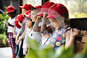 Group of kindergarten kids learning gardening outdoors field trips photo