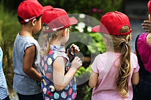 Group of kindergarten kids learning gardening outdoors field trips