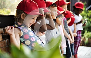 Group of kindergarten kids learning gardening outdoors field trips
