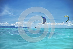 Group of kite surfers in the sea