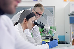 Group of  Laboratory scientists working at lab with test tubes, test or research in clinical laboratory.Science, chemistry,
