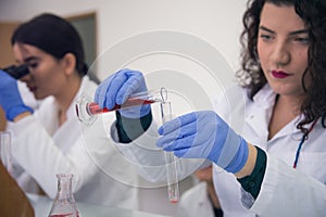 Group of  Laboratory scientists working at lab with test tubes, test or research in clinical laboratory.Science, chemistry,