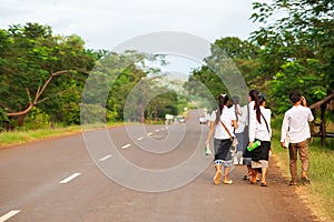 A group of Laotian high school walking home from school photo