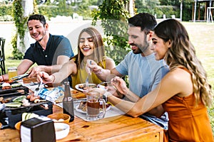 Group of latin friends eating mexican food in the restaurant terrace in Mexico Latin America