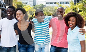 Group of laughing african american man and woman walking in the