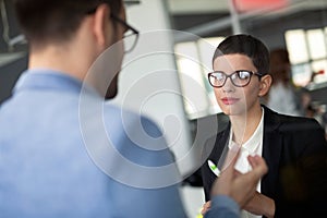 Group of lawyers discussing contract together in office