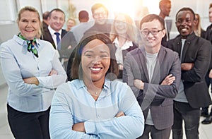 group of leading experts standing in the office lobby .